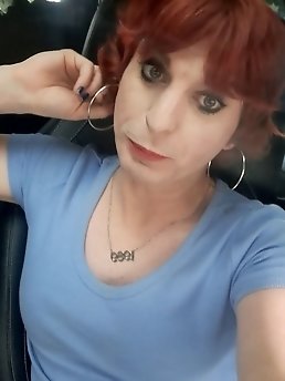 Kellycd2022, the amateur crossdresser, flaunts her seductive charm in a provocative pink bodysuit.