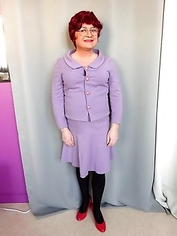 A cross-dressing transvestite in old underclothes.