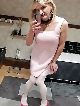 A feminine looking girl has her behind pierced and is wearing a thong.